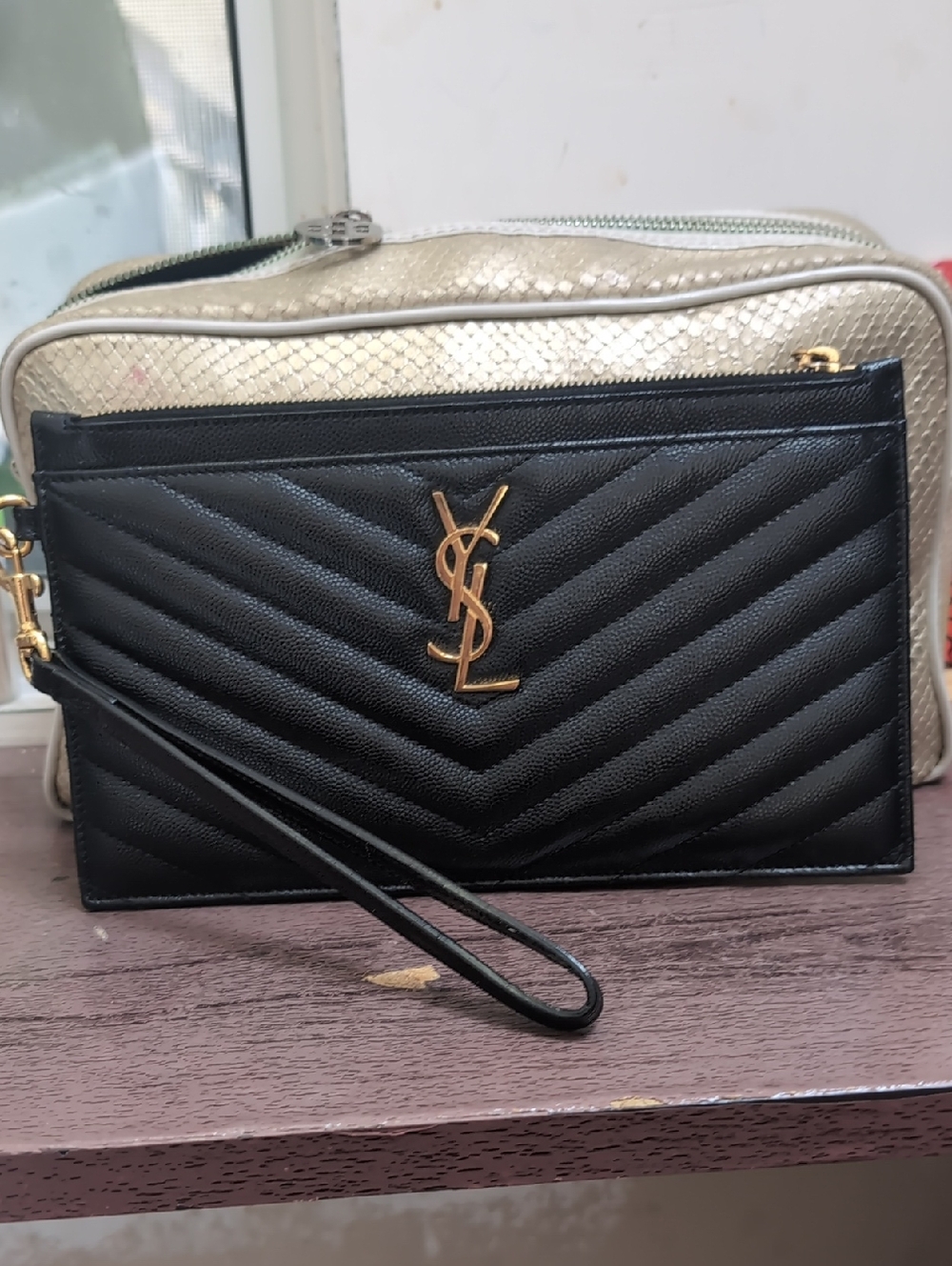 YSL BLACK AND GOLD CLUTCH